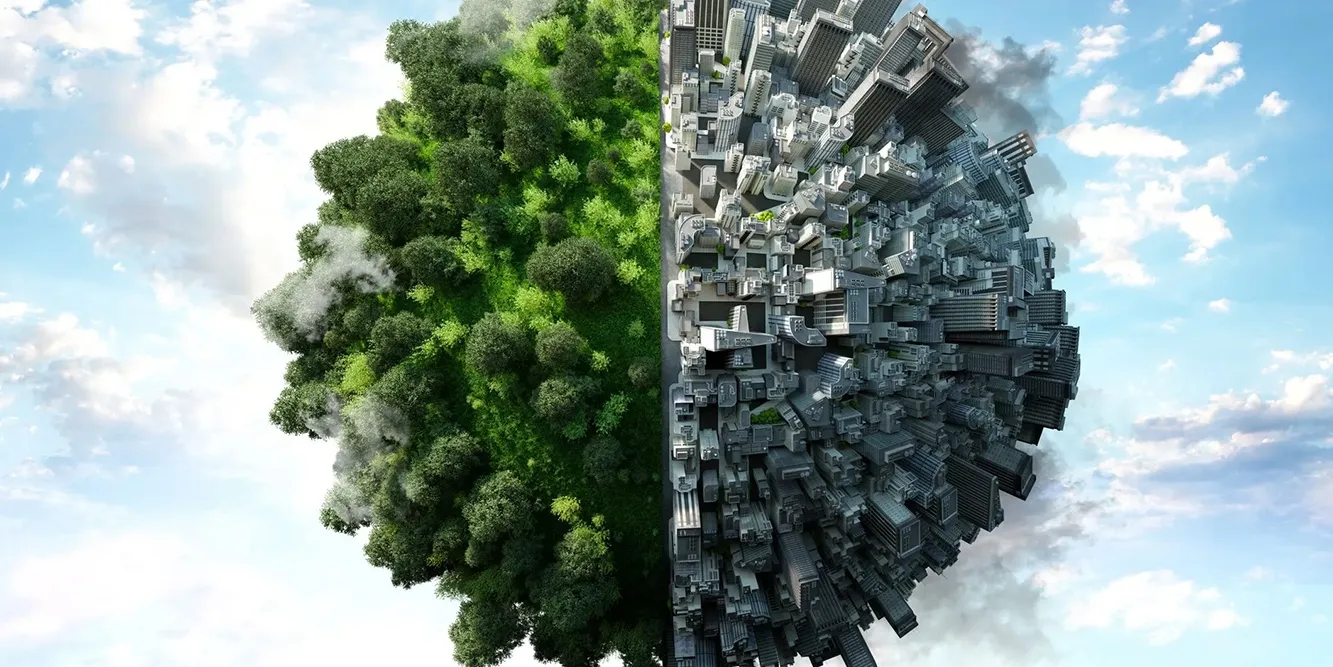Mondo diviso in due, da una parte alberi e dall'altra case e inquinamento
