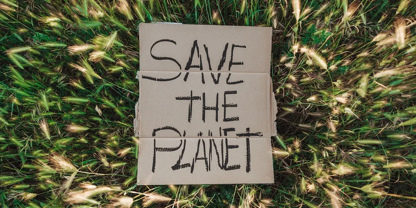 Cartellone con scritta Save the Planet